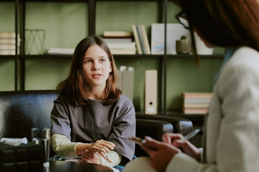 Child Engaging With Healthcare Professional During Consultation